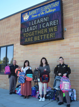 Utah Highway Patrol Gives Backpacks to Barnett and Wilson Elementary Schools